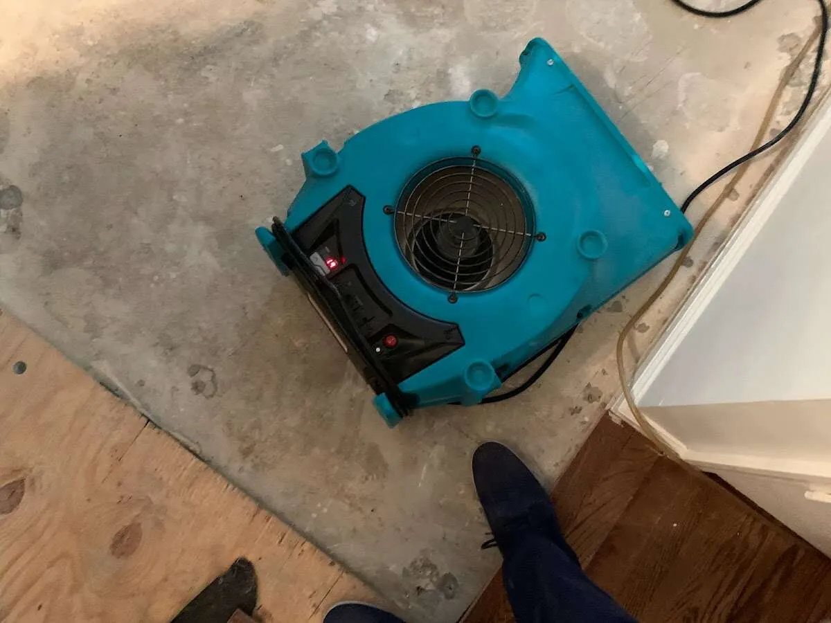 Air mover drying subfloor during Leak Detection & Repair in Oklahoma City